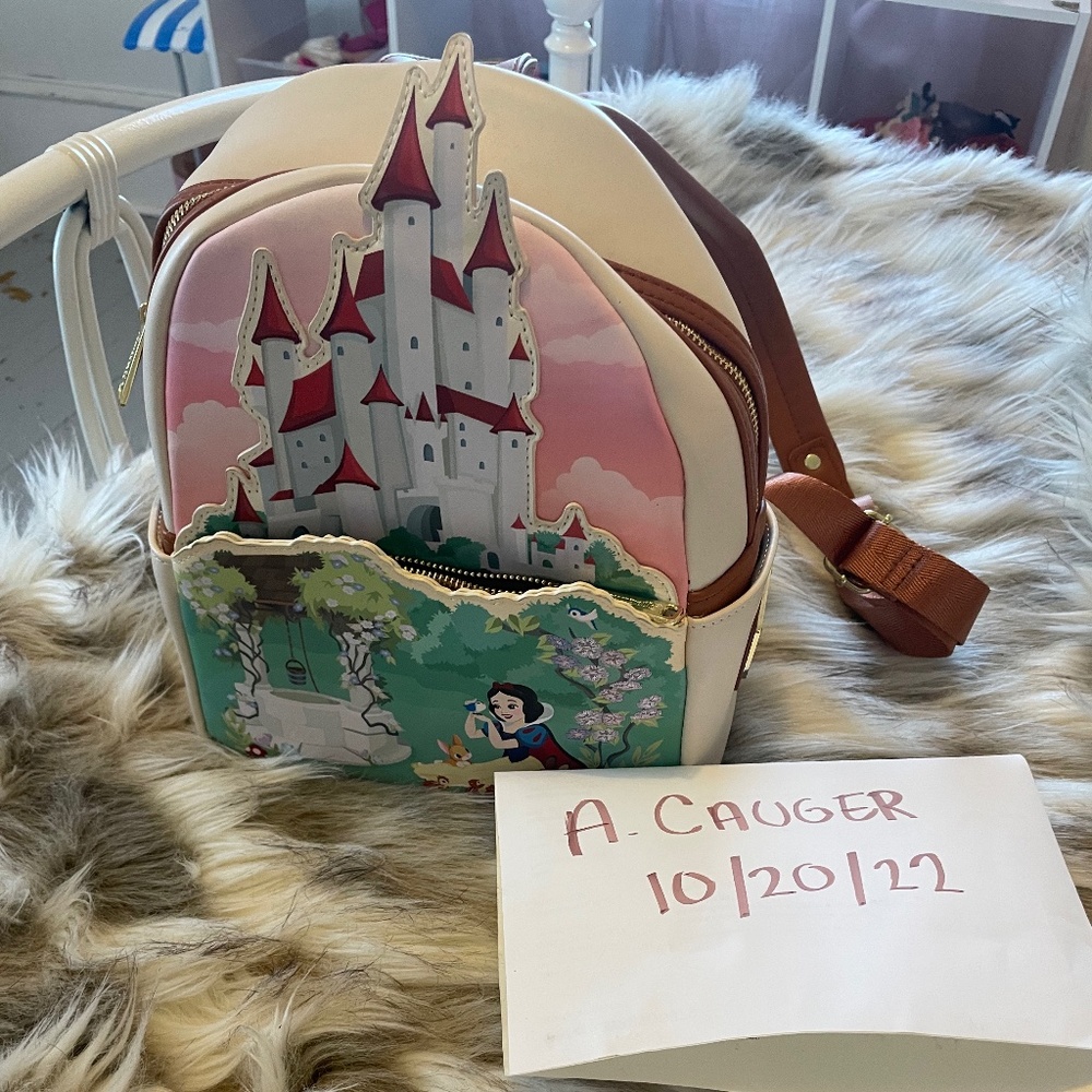 Show white loungefly backpack